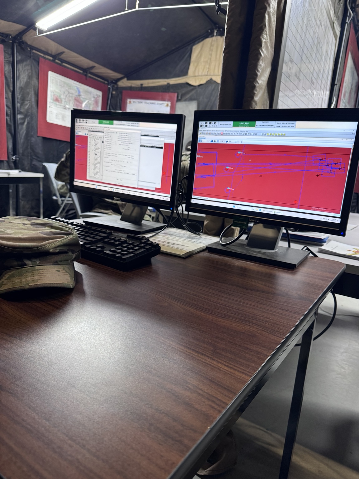 Computer workstations and equipment inside a military training tent